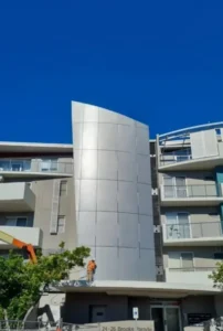 SCE workers undertaking controlled cladding installation at Belmont