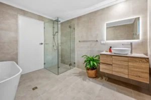 Completed bathroom with tiled finishes in renovated Toronto home