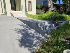 Completed concrete driveway and entry steps at an SCE project in Terrey Hills