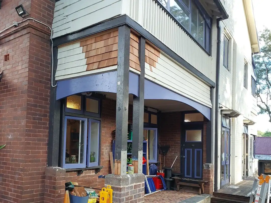 Reinstated timber shingles following structural remedial works at a Lane Cove school