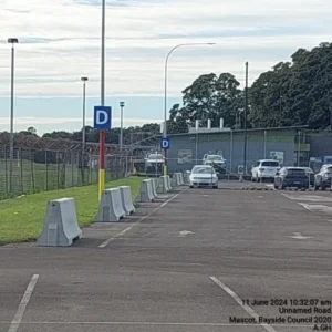 Completed line of concrete barriers beside Sydney Airport Blue Emu Car Park.