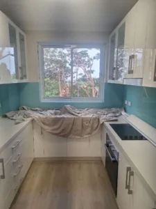 Completed white-framed replacement window above the kitchen bench in Greenwich NSW