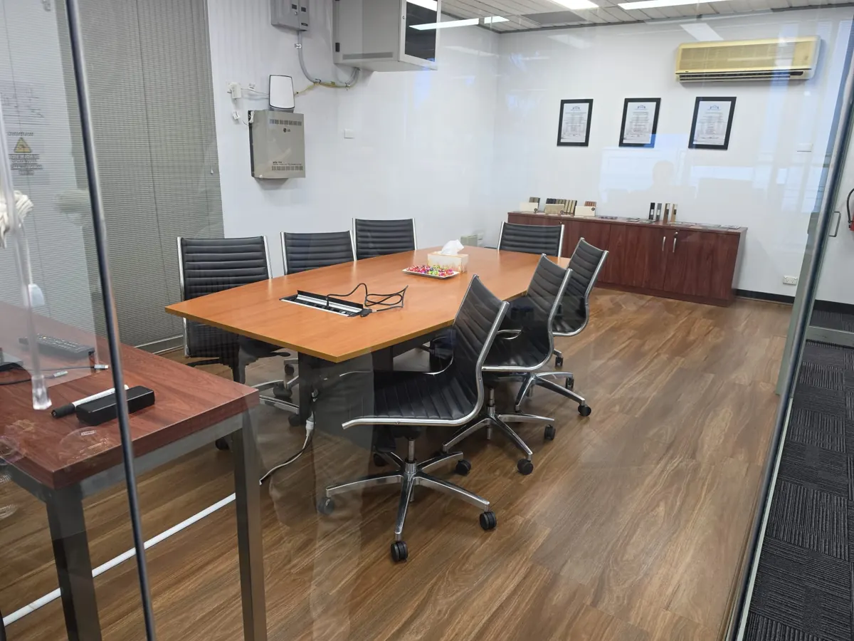 Artarmon meeting room after renovation with new timber-look flooring and repainted walls