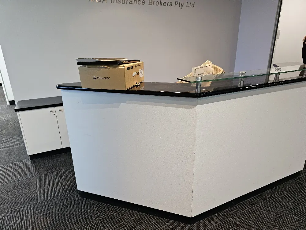 Artarmon office reception before renovation, showing the original plain counter front
