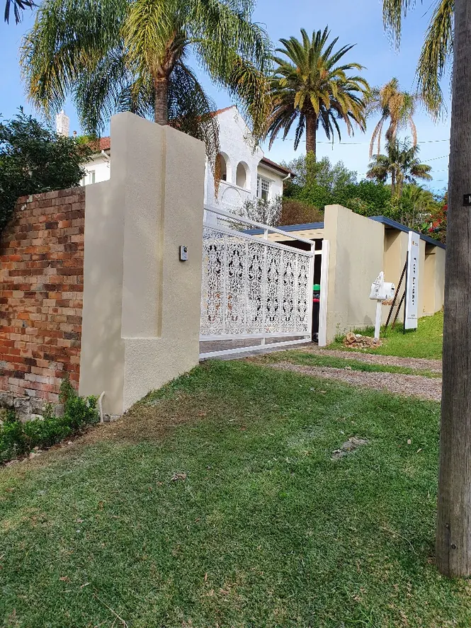 Finished rendered pier, brick wall and decorative gate after the Balgowlah repairs