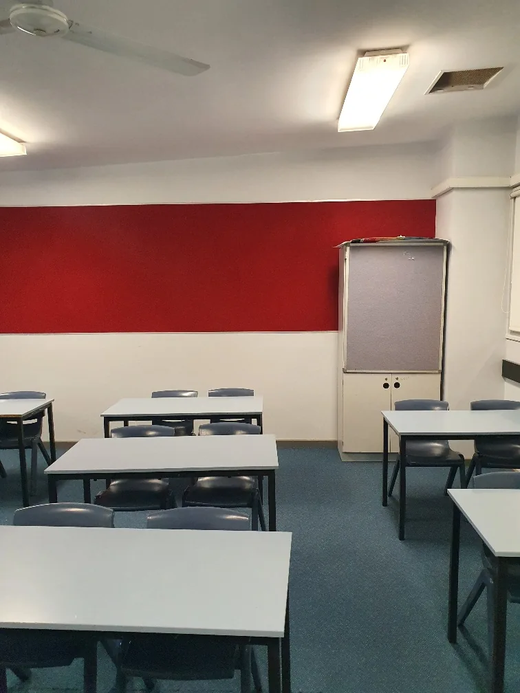Completed Cherrybrook classroom showing acoustic panels, desks and whiteboard