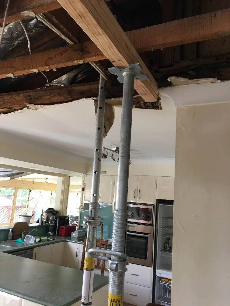 Temporary steel props supporting exposed roof timbers inside the Grays Point property